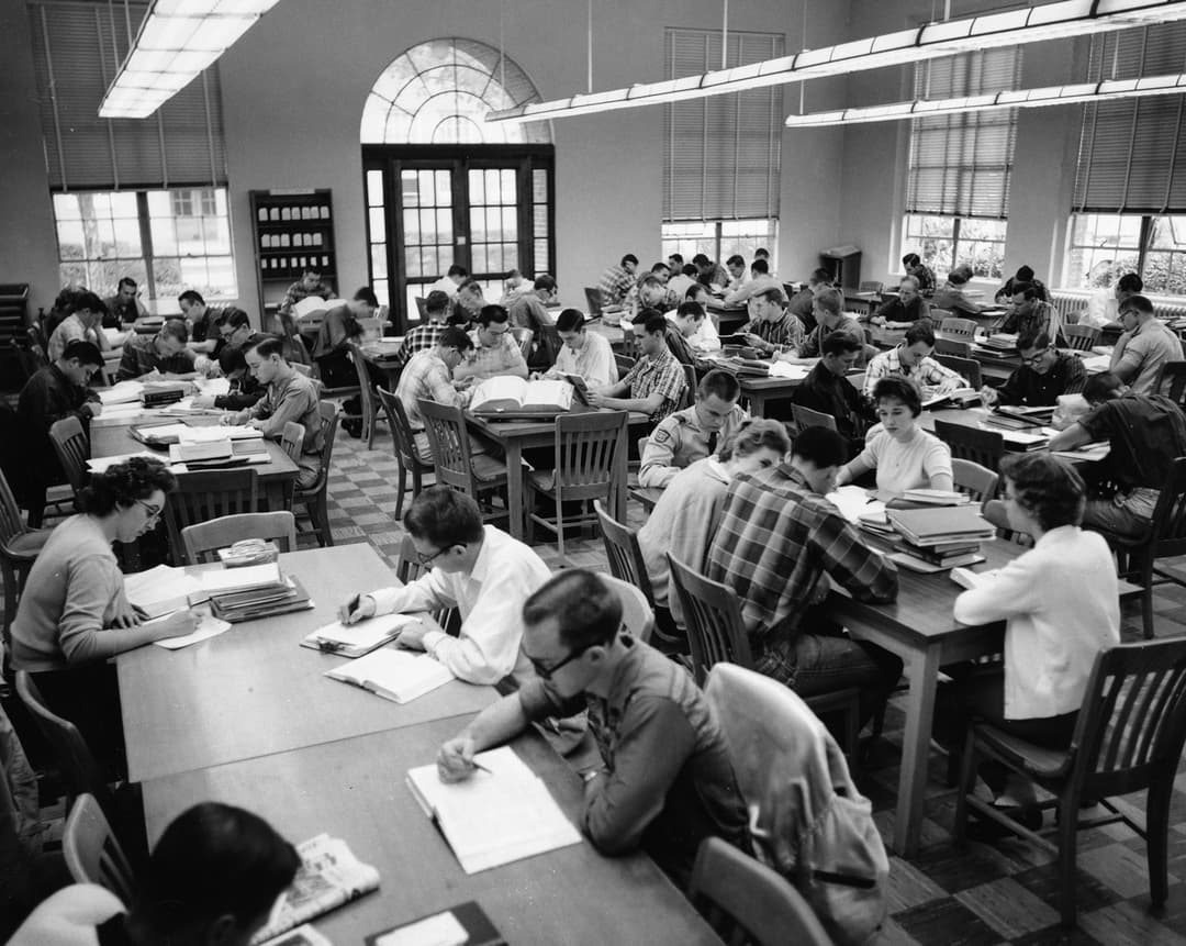 Students reviewing study abroad documents and application tasks